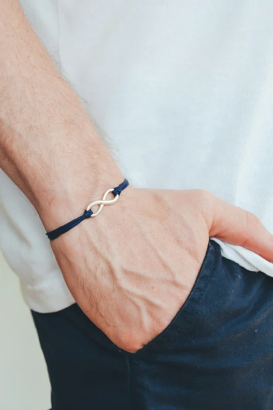 Adjustable silver infinity bracelet for men, blue cord, yoga jewelry