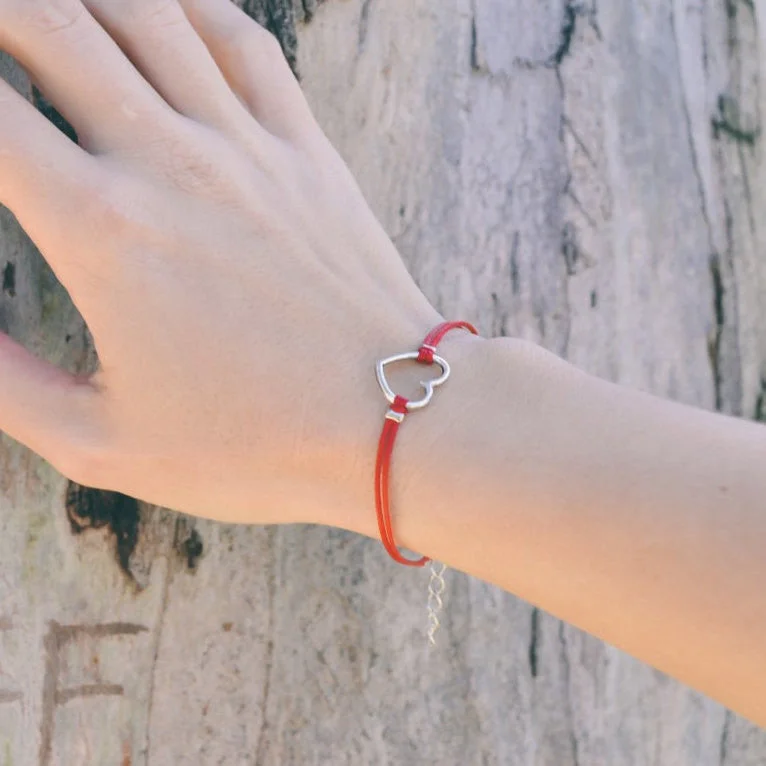 Red bracelet with silver heart charm, adjustable bracelet