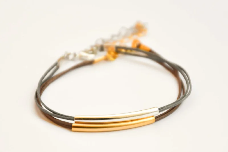 Silver and gold plated tube charms bracelets, gray and brown cords