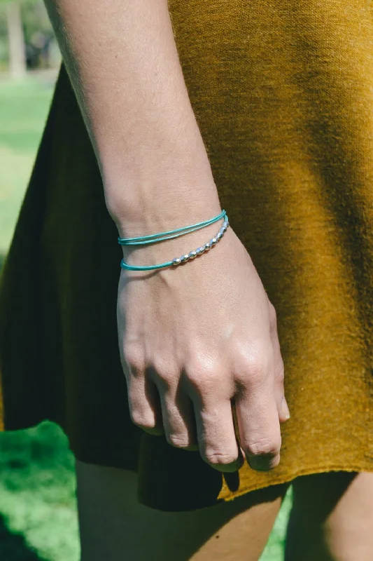 Silver beads bracelet, turquoise cord