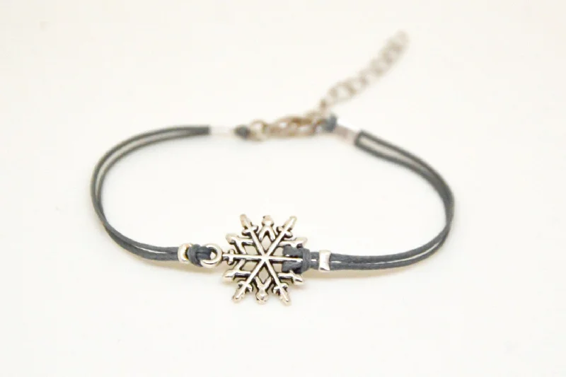 Women bracelet with silver snow flake charm, gray cord