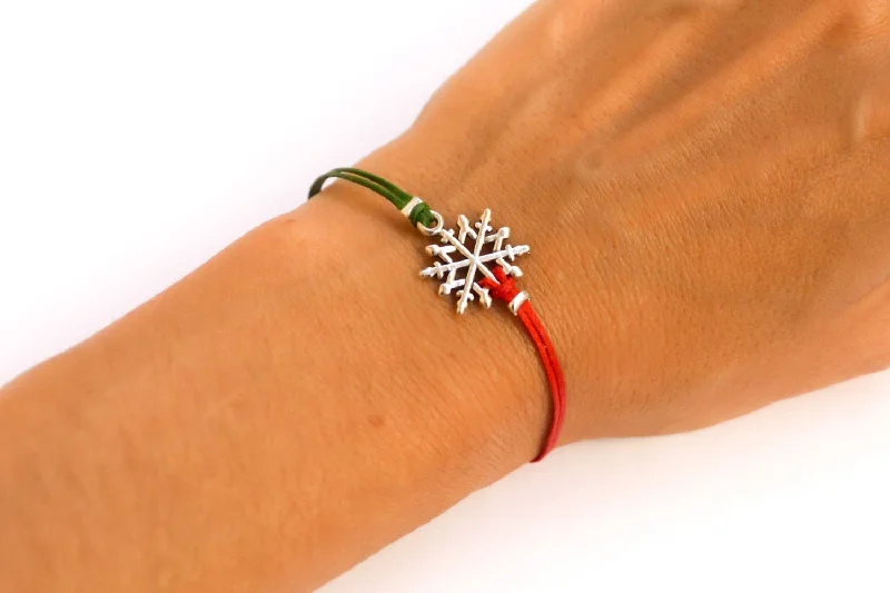 Women bracelet with silver snow flake charm, red and green cords