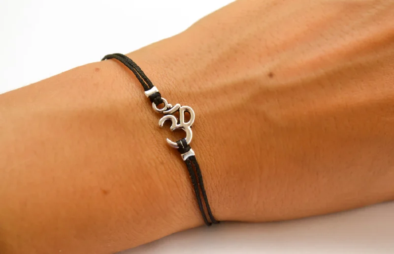 Women bracelet with silver tone Om charm, yoga jewelry